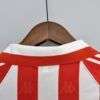 Présente le col du maillot vintage Athletic Bilbao Domicile 1995/1997