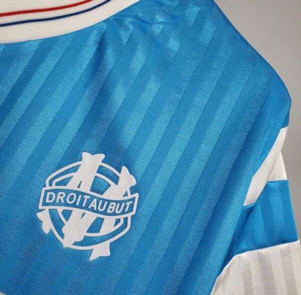Zoom sur le logo du maillot vintage Olympique de Marseille Extérieur 1989/1991.