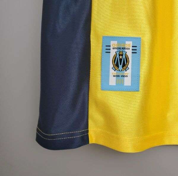 Zoom sur le logo du maillot vintage Olympique de Marseille "Centenaire" 1998/1999.
