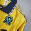 Zoom sur le logo du maillot vintage Olympique de Marseille "Centenaire" 1998/1999.