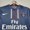 Zoom sur les logos du maillot vintage Paris Saint-Germain Domicile 2012/2013.