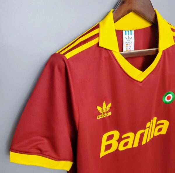 Présente la manche et col du maillot vintage AS Rome Domicile 1991/1992