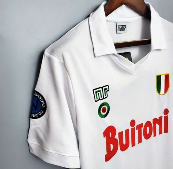 Présente la manche et col du maillot vintage Naples Extérieur 1987/1988