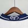 Présente le col du maillot Real Madrid 2001