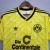 Zoom sur les logos et col du maillot vintage Borussia Dortmund Domicile 1988/1989