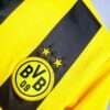 Zoom sur le logo du maillot vintage Borussia Dortmund "Ligue des Champions" 2012/2013