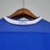 Présente le col du maillot vintage Chelsea Domicile 2003/2005