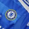 Zoom sur le logo du maillot vintage Chelsea Finale Ligue des Champions 2012