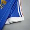 Présente le col du maillot vintage France Domicile Coupe du Monde 1982