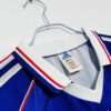 Présente le col du maillot vintage France Finale Coupe du Monde 1998