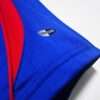 Présente la manche et logo du maillot vintage France Domicile Coupe du Monde 2006