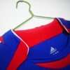 Présente le col du maillot vintage France Domicile Coupe du Monde 2006