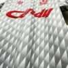 Présente les logos et col du maillot vintage Liverpool Extérieur 1989/1991
