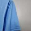 Présente la manche et coutures du maillot vintage Manchester City Domicile 2011/2012