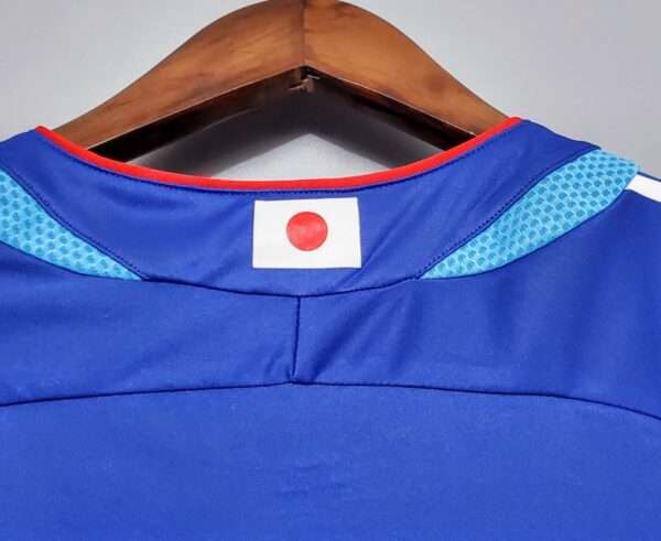 Présente le col du maillot vintage Japon Domicile Coupe du Monde 2006