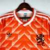Présente le col et logos du maillot vintage Pays-Bas Domicile 1988
