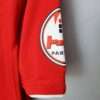 Zoom sur la manche, logo et coutures du maillot vintage Urawa Red Diamonds Domicile 2008/2009