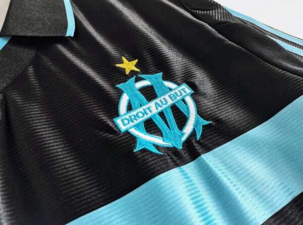 Présente le logo du maillot vintage Olympique de Marseille "Troisième" 1999/2000